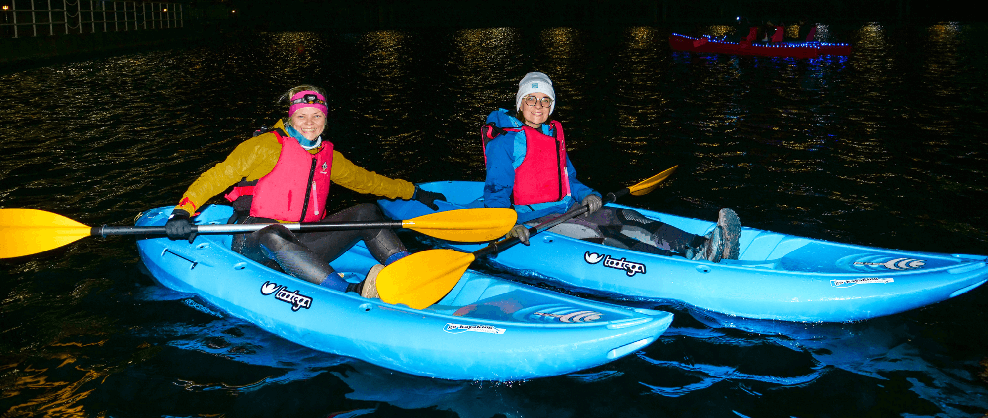 Two people in a kayak during Moonlight Paddle