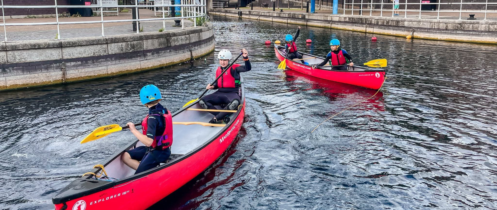 Young people in canoes
