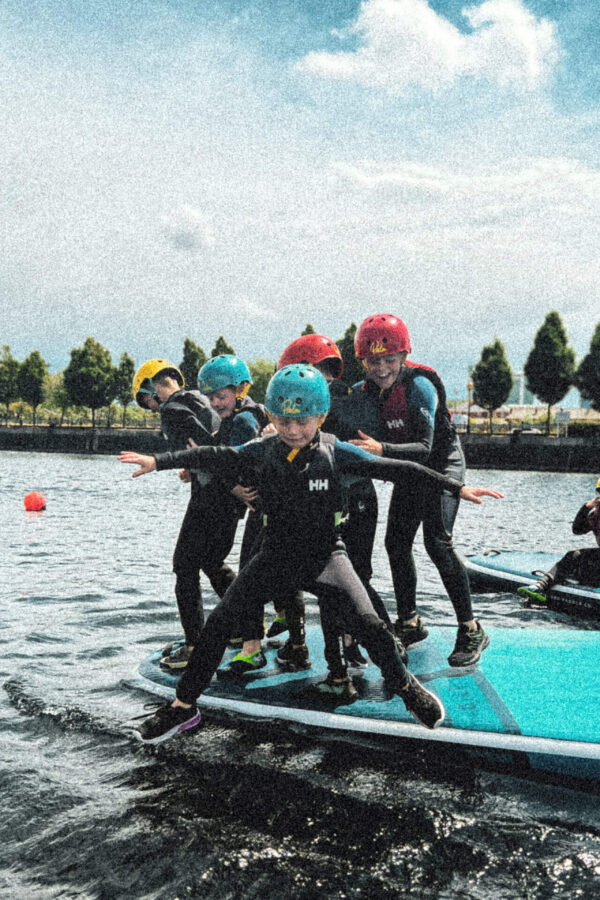 Children on a giant SUP